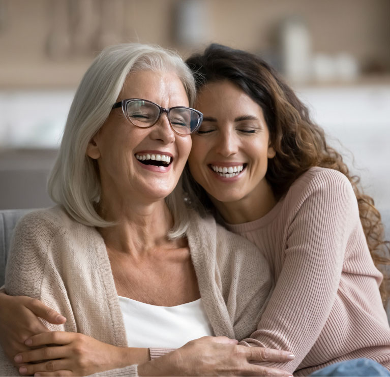 mishawaka women embracing and laughing