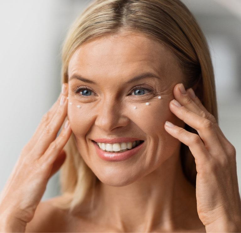 woman smiling with treatment dots
