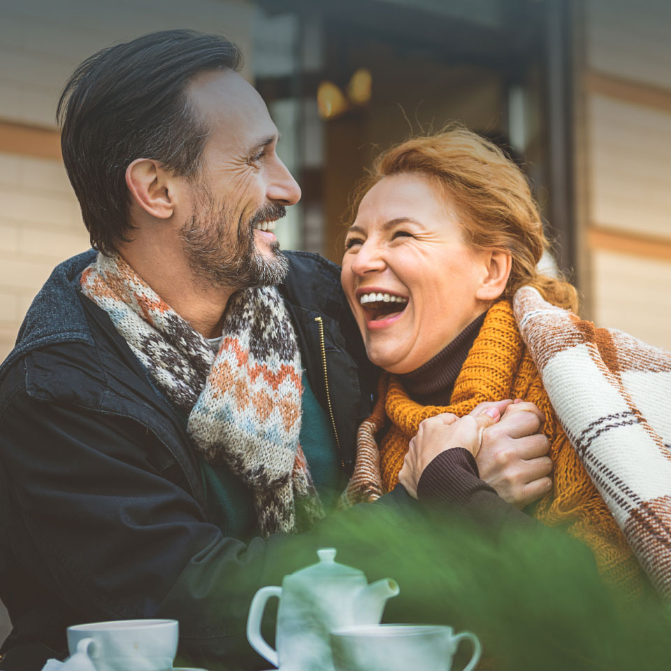 couple laughing outside chilly weather