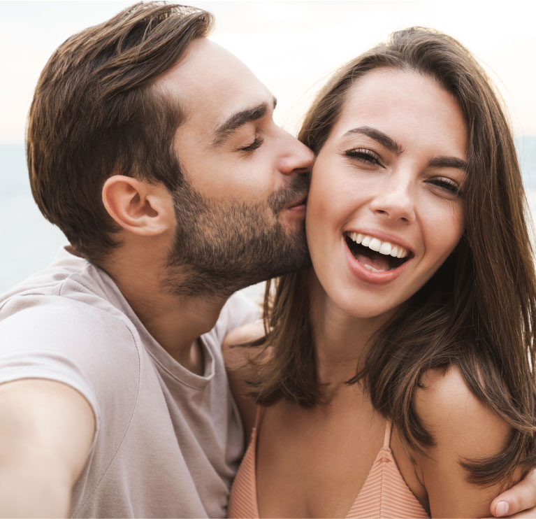 mishawaka guy kissing smiling woman on cheek