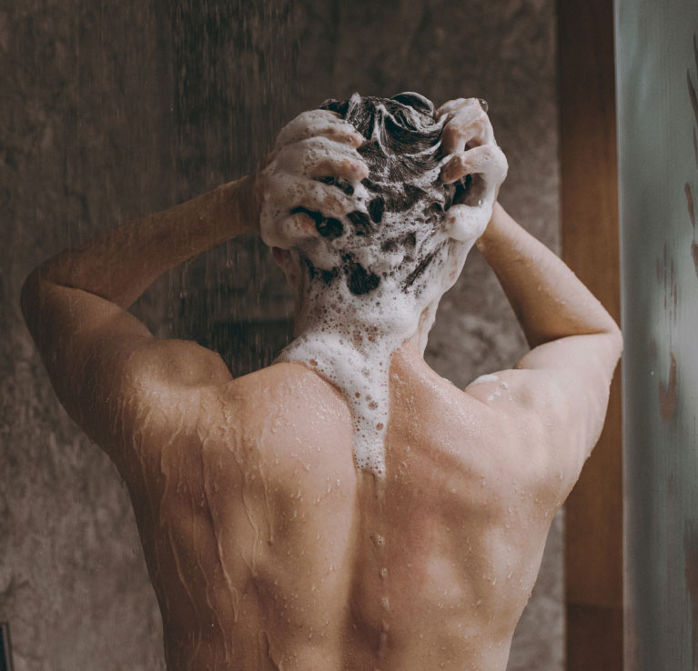 tattoo removal model in shower with clean back