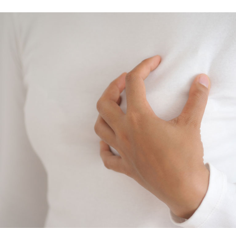 woman self breast exam
